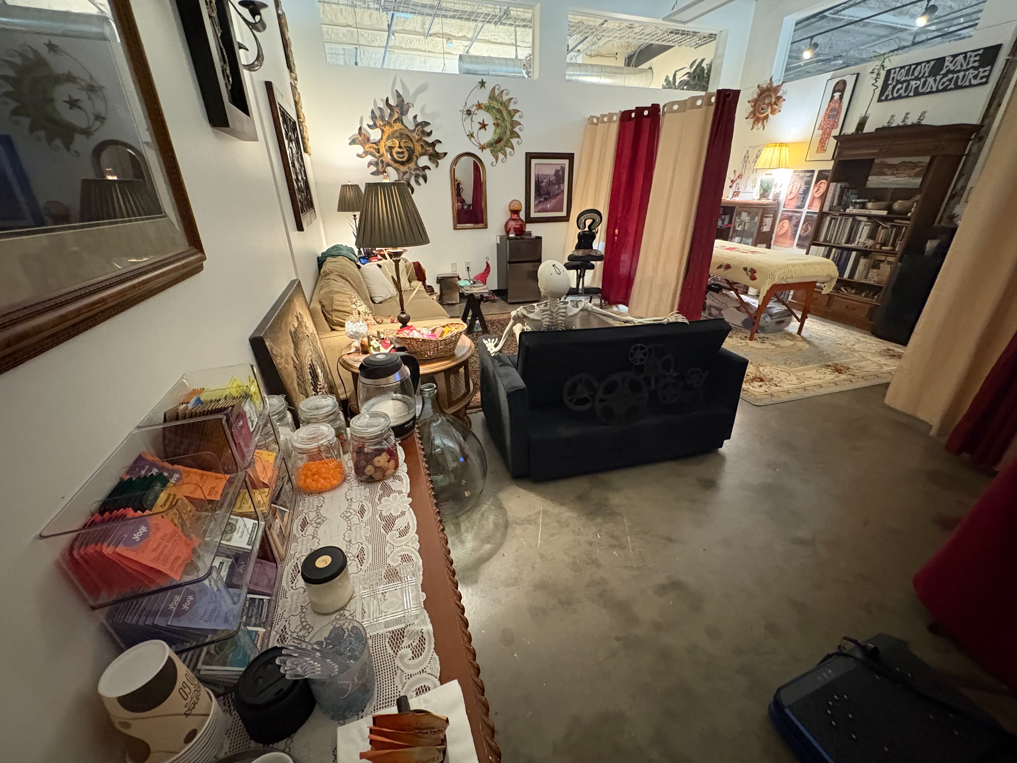 Kym's actual acupuncture treatment room at WOMPA, with the treatment table and art-filled surroundings