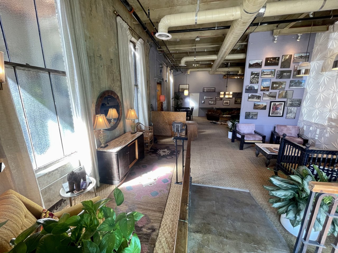 Retro-style sofas, artwork and decor in another indoor WOMPA sitting area